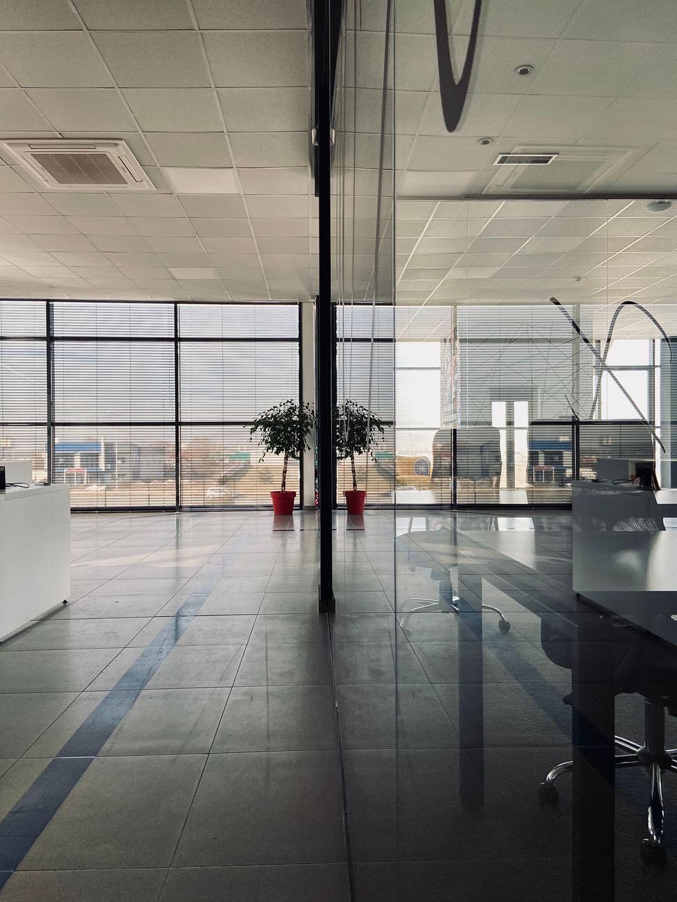 A bright glass office lobby